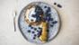 Rolled lemon pancakes with blueberries and yoghurt