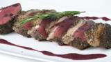 Peppered loin of venison with red wine sauce
