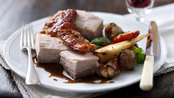 Roast belly of pork with root vegetables