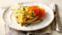 Buckwheat blinis with scrambled eggs and smoked salmon