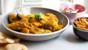 Chicken and apricot curry with potato straws (sali murghi)