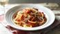 Pasta with chilli, bacon and tomato sauce